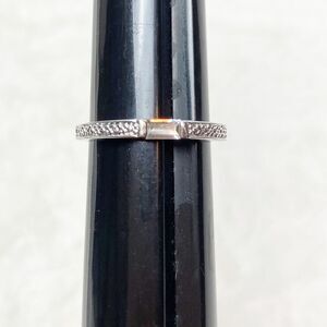 Thin silver tone and clear stone ring